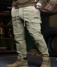 Men wearing Urban Explorer Cargo Pants in outdoor urban setting showcasing multiple cargo pockets and durable design