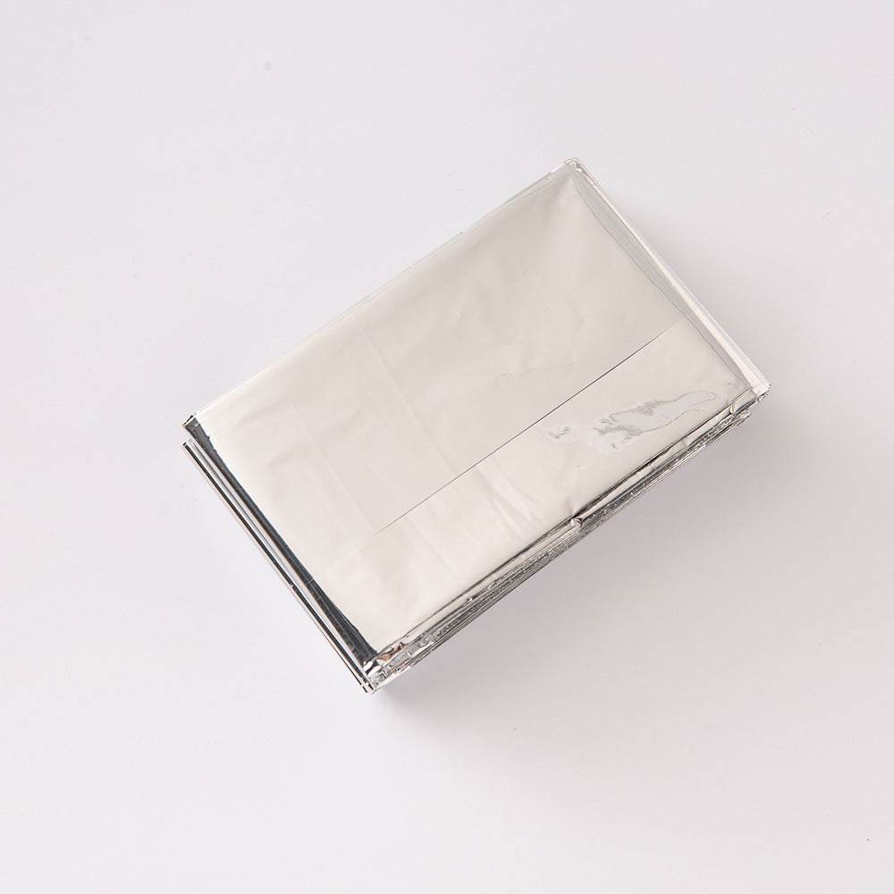 Double-sided silver and gold emergency blanket for outdoor survival and thermal insulation