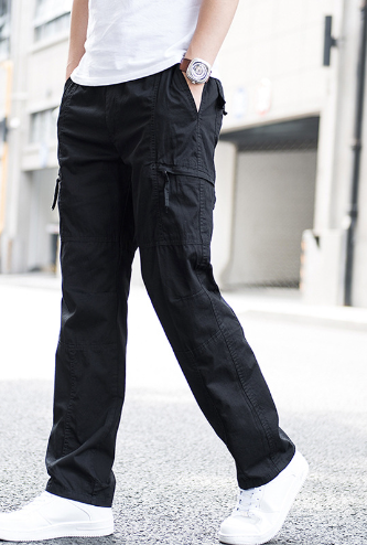 Man wearing relaxed casual cargo pants with multiple pockets in basic Volkswagen style