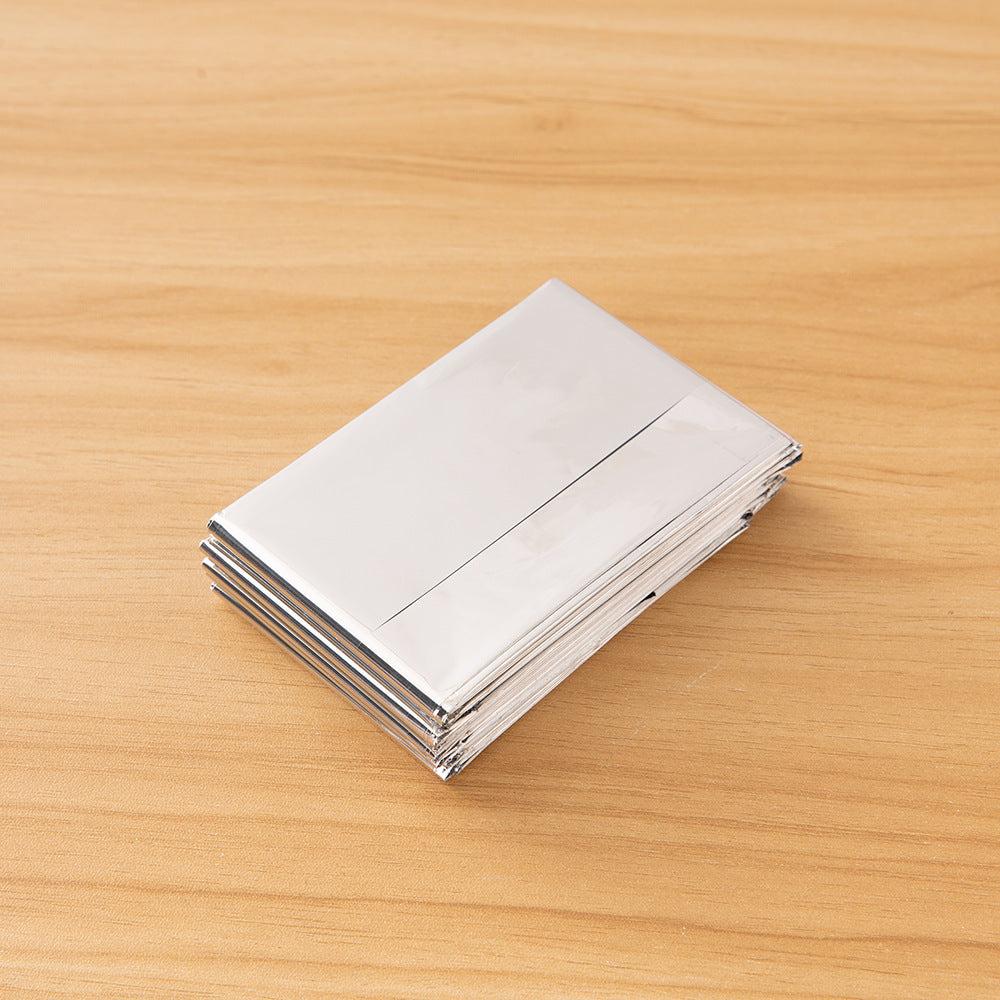 Double-sided silver and gold emergency blanket for outdoor survival and thermal insulation