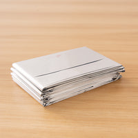 Double-sided silver and gold emergency blanket for outdoor survival and thermal insulation